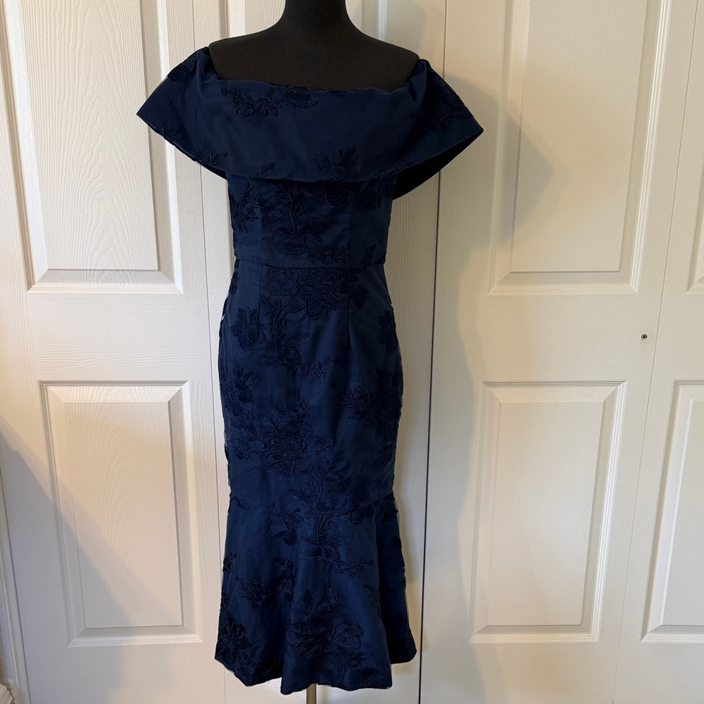 Tea length off the shoulder dress.